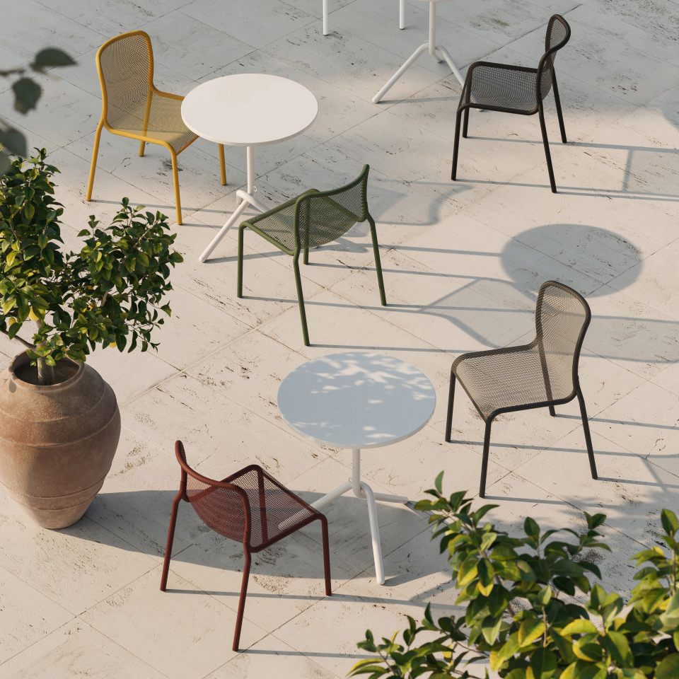 overhead view of chairs in many colors on exterior patio