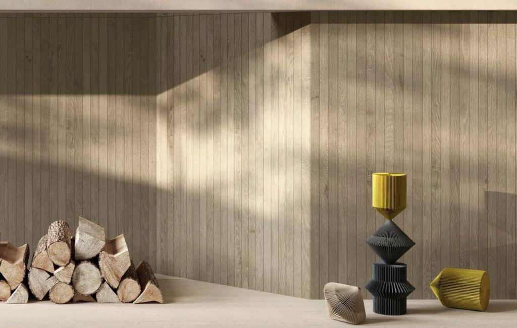 Think silver planks with expressionistic sculpture and pile of wood