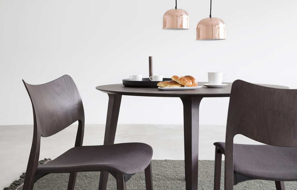 Laclasica chairs dark stain with brown upholstery at dining table
