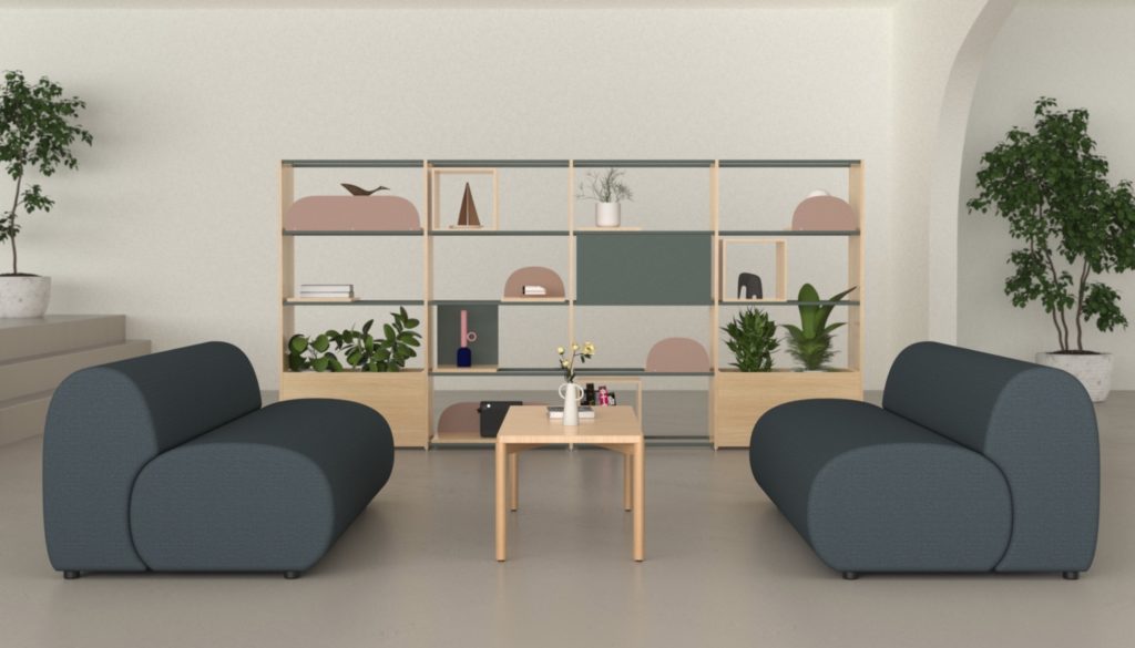 two sofas in slate blue facing each other with coffee table in between and open shelving beyond