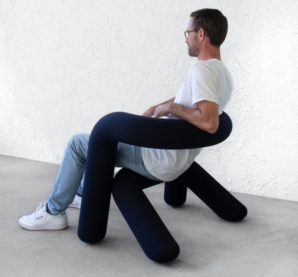 Extra Bold chair with man sitting