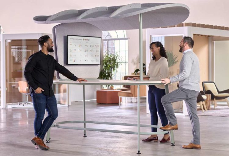 Fleet table with three people standing