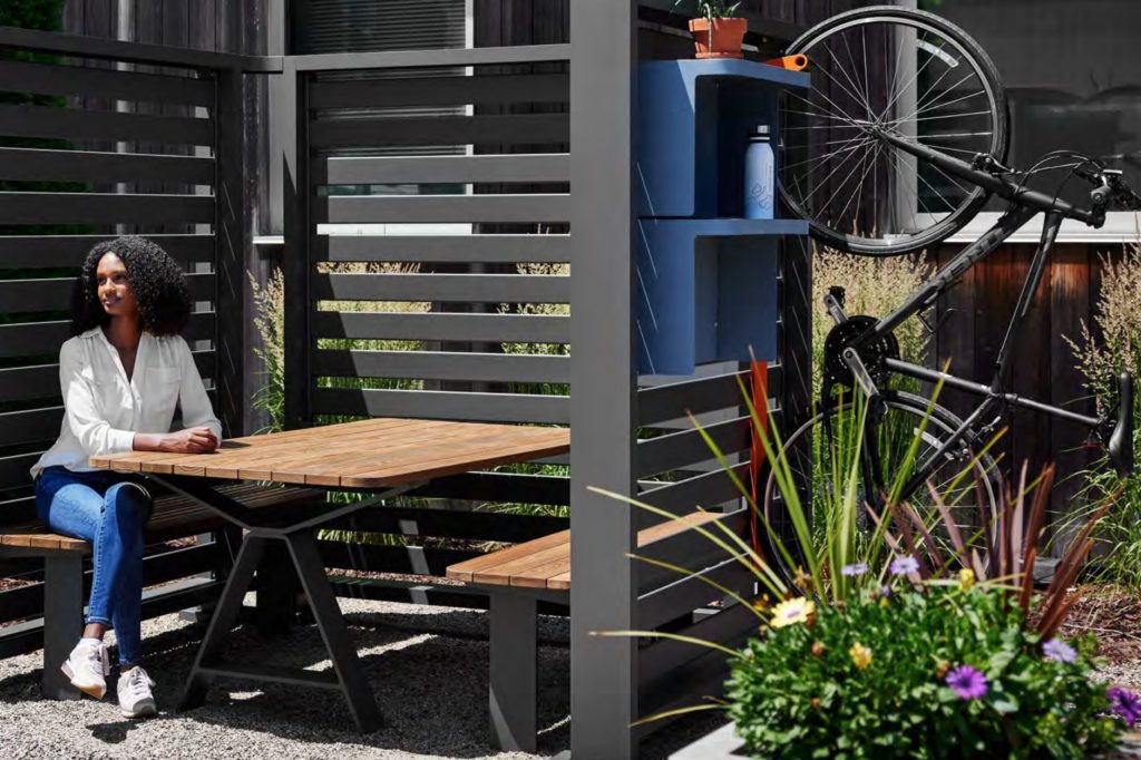 Woman at table with bike rack