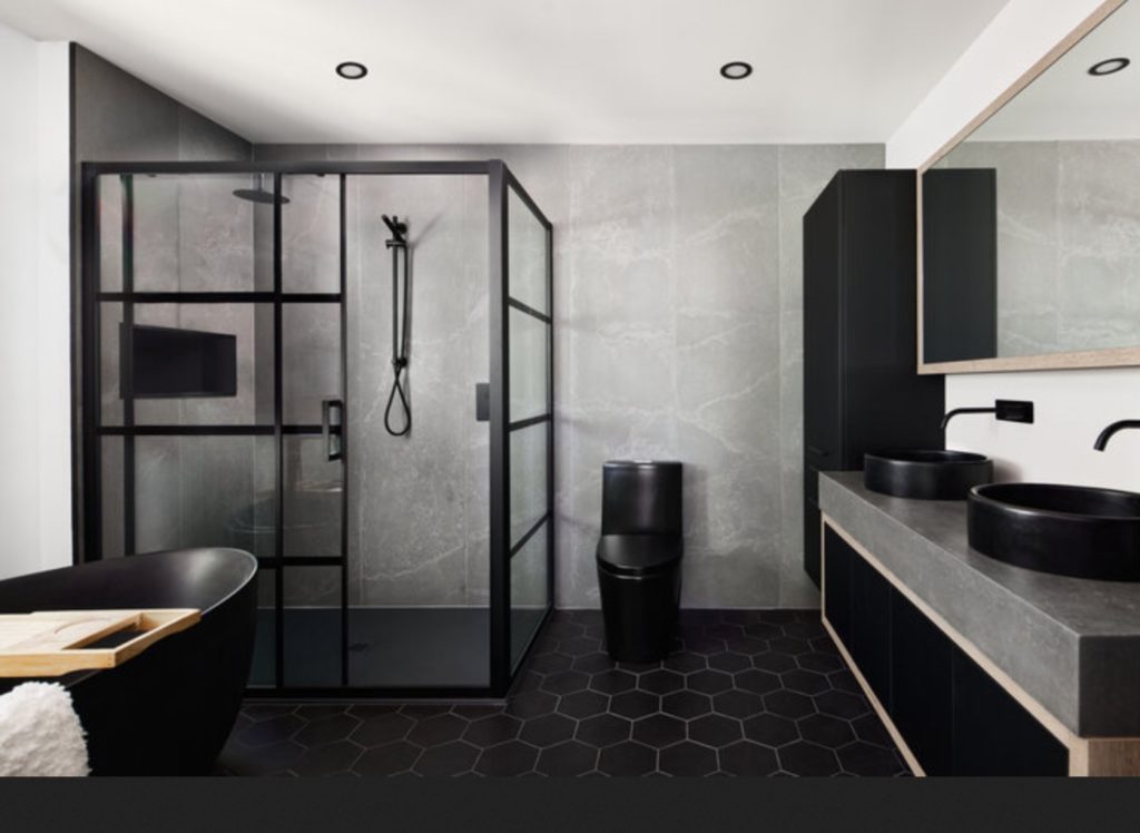 bathroom with wall panels made of poured concrete