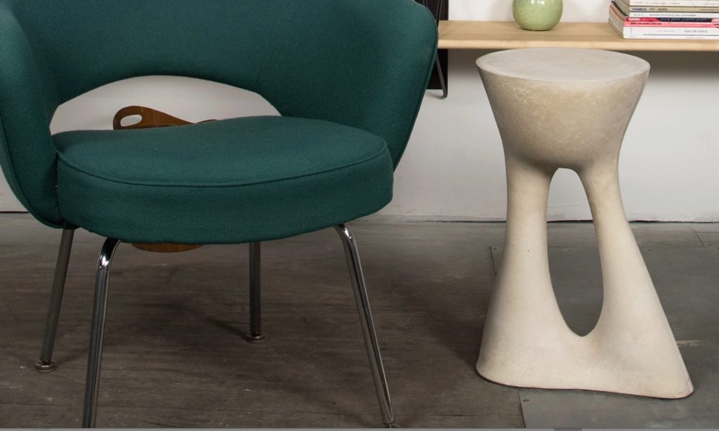 Table next to green chair