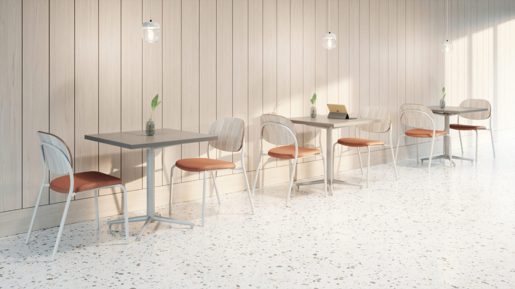 Acorn pendant light in white above tables at café