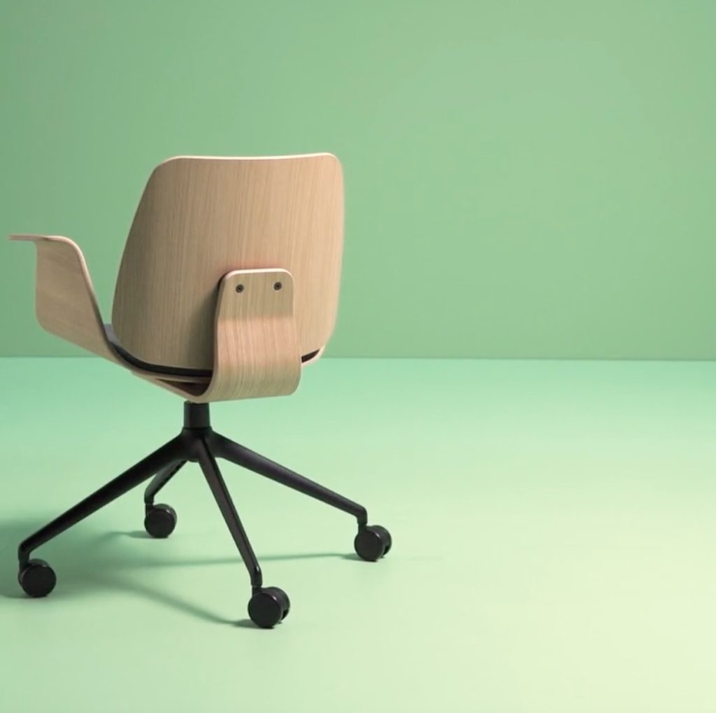 Klasik wood swivel arm chair in green room view from back