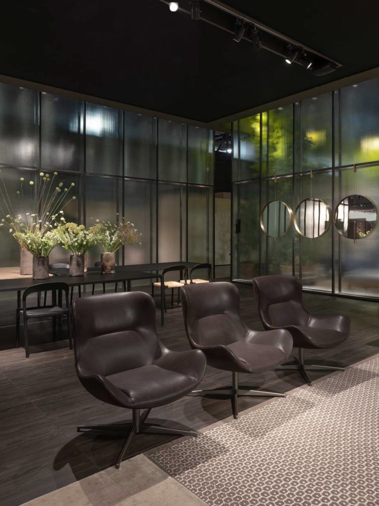 Living Divani chairs. Three chairs in chocolate in a row.