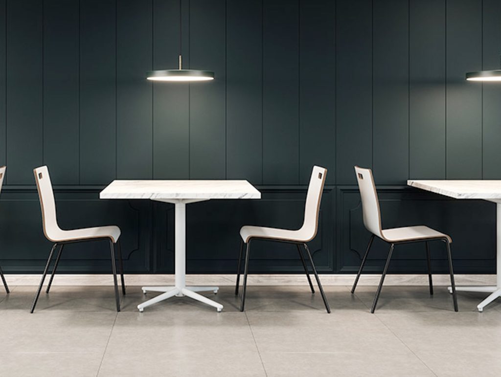 White on white tables with white chairs in café setting