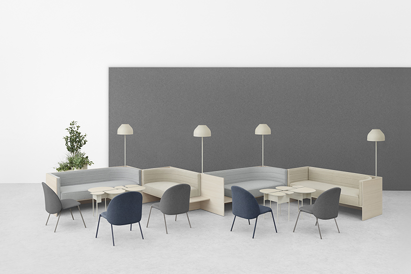 enKAK sofas and booths set up with small tables and multi-use chairs and floor lamps