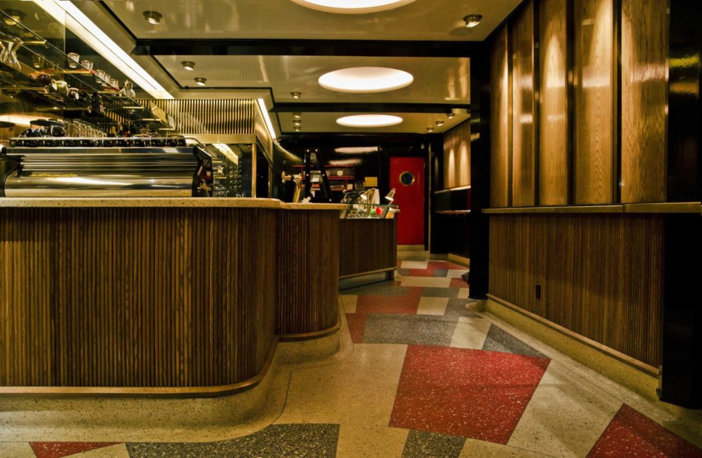 Surfacing Solution panels on bar in dark wood with modern vibe