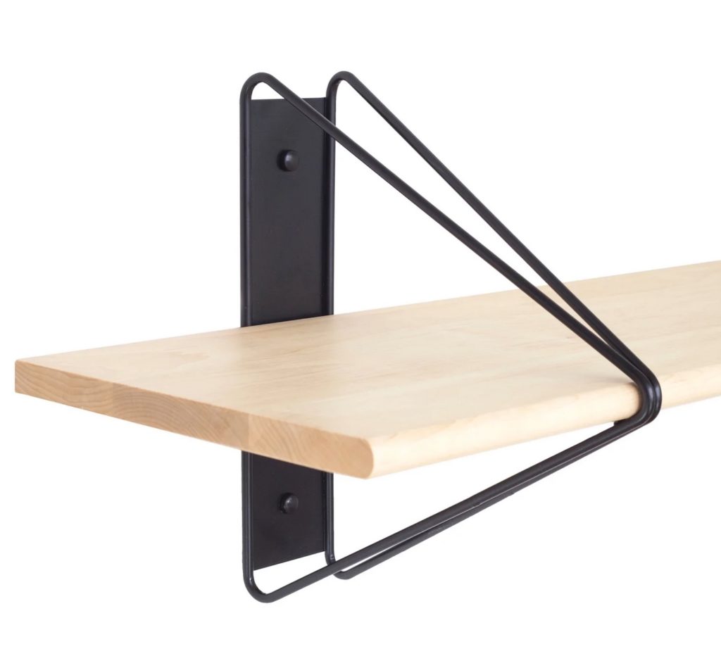 Bookcase detail with wood shelves and black hardware