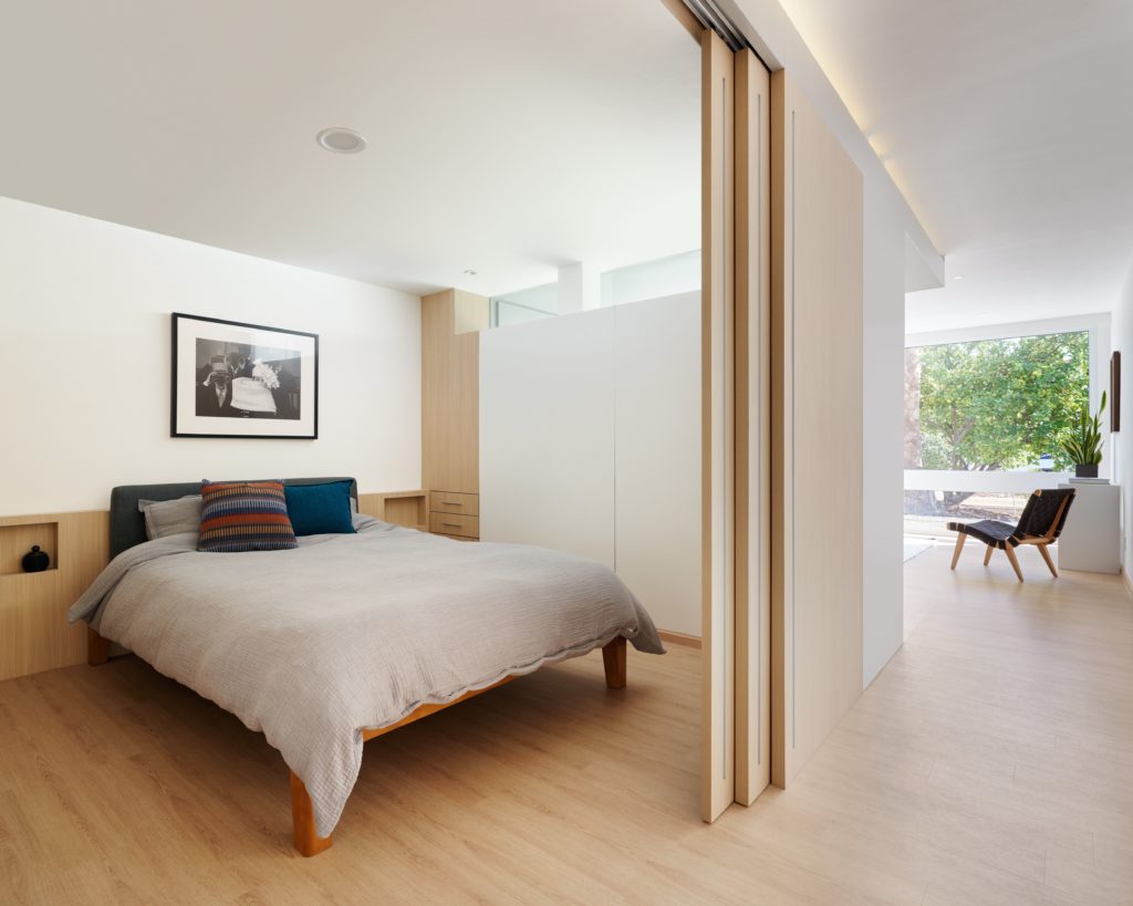 Cassette bedroom with partial view of living area