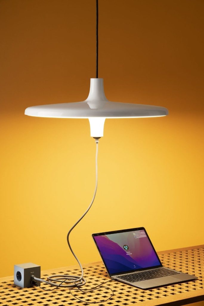 light with multi-socket beneath powering computer