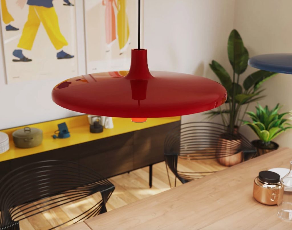 View from above of a reddish/orange pendant lamp above a kitchen table