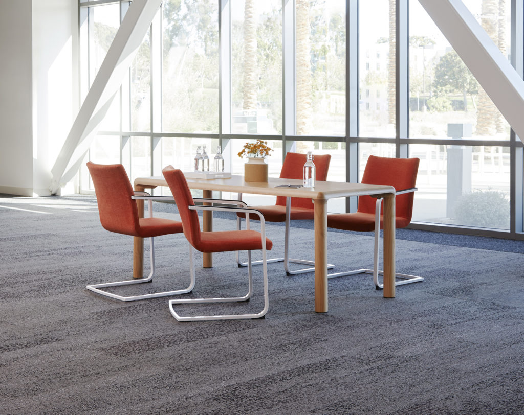 Conduit table in casual setting, low version, maple with four chairs