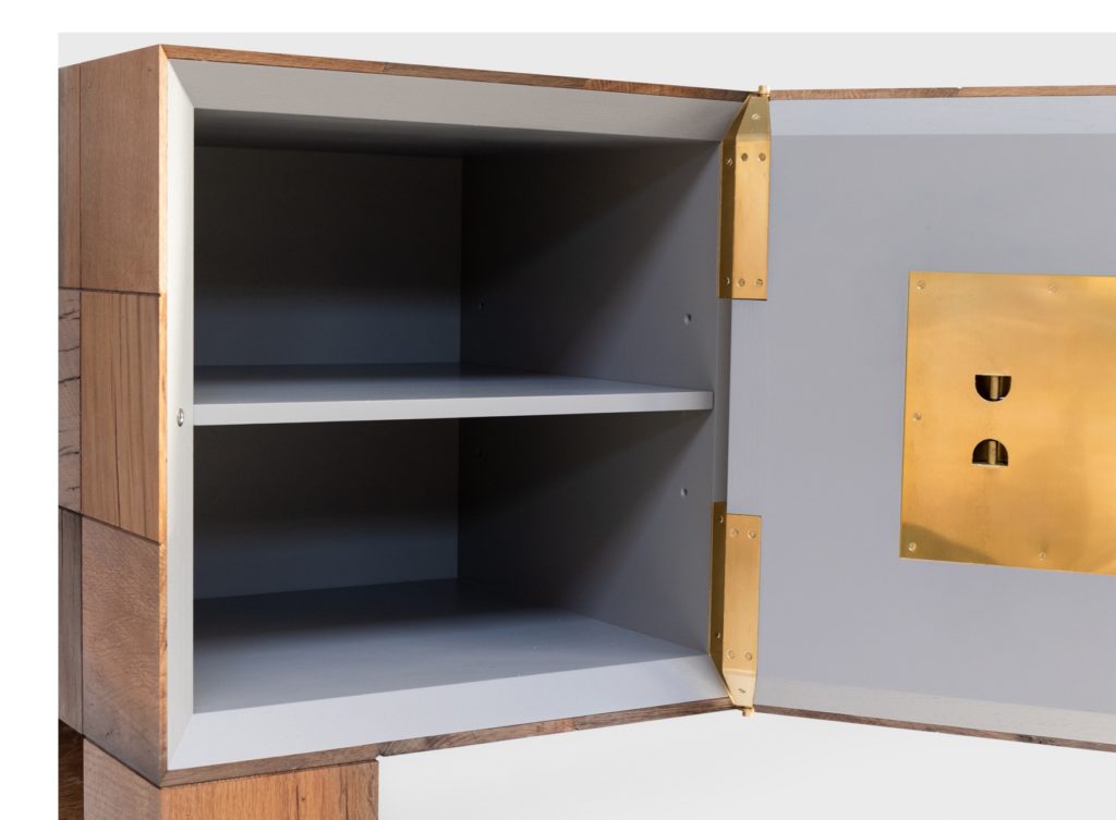 detail of dresser with open door and storage space