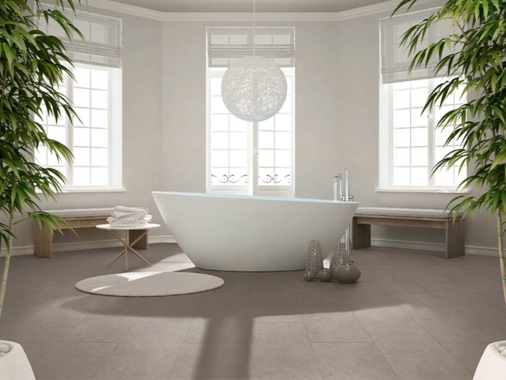 large-format porcelain tiles on bathroom floor in medium gray color