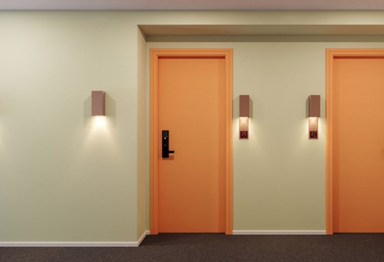 Alva entrance lighting three down-light sconces in apartment building hallway