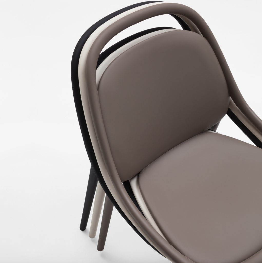 Quittlet detail with taupe, ivory, and black chairs in stacked configuration