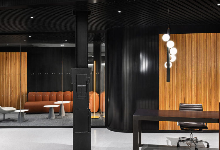 Fino glass wall in consultancy firm with wood panels and dark walls