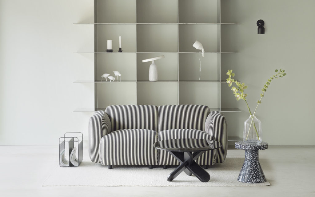 living room with sofa and Klip lamp