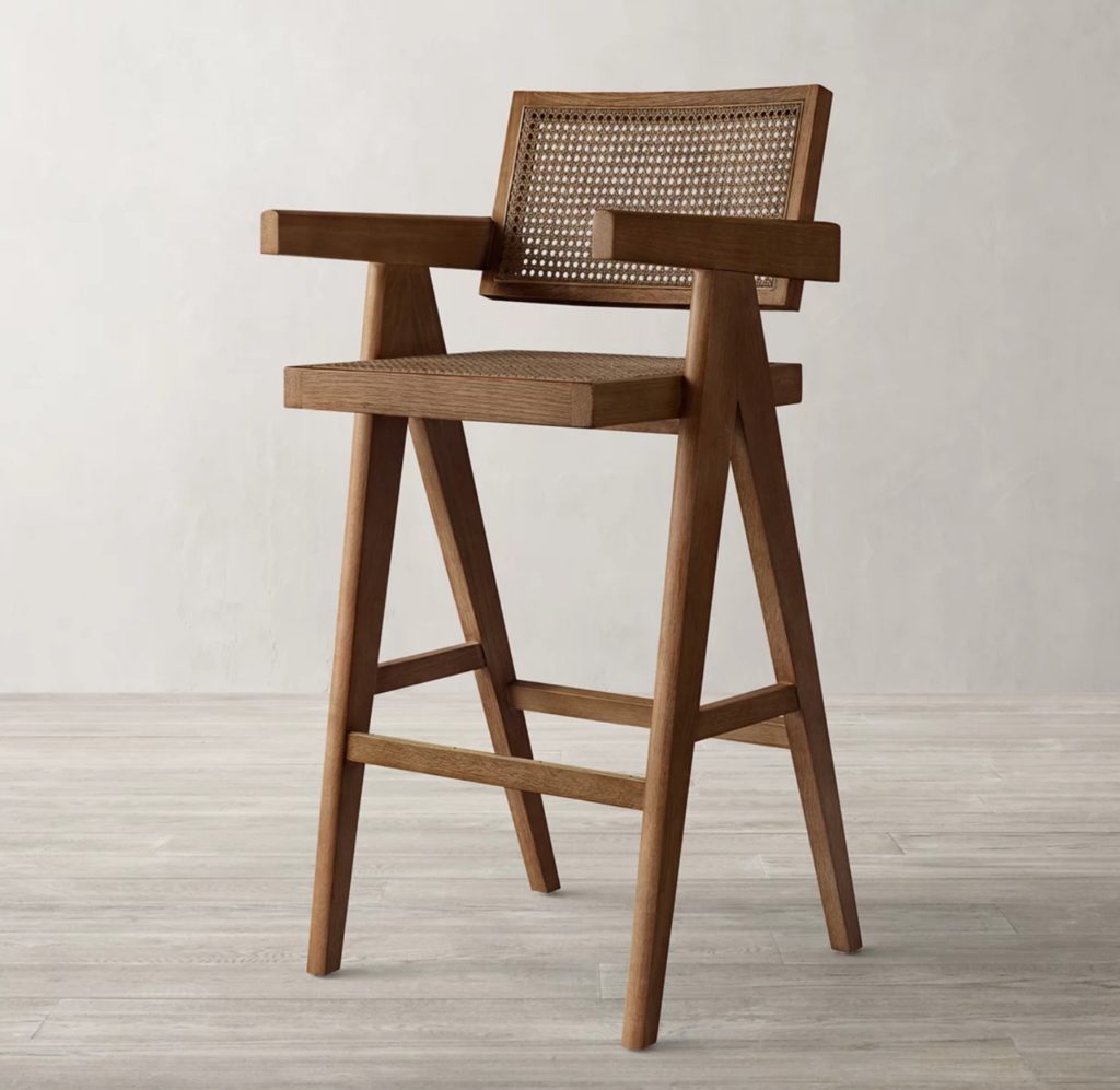 a cane stool in walnut/caramel color