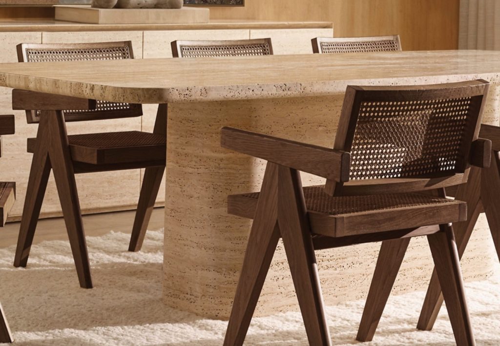 Jakob chair in caramel. Several chairs around a tan granite dining table.