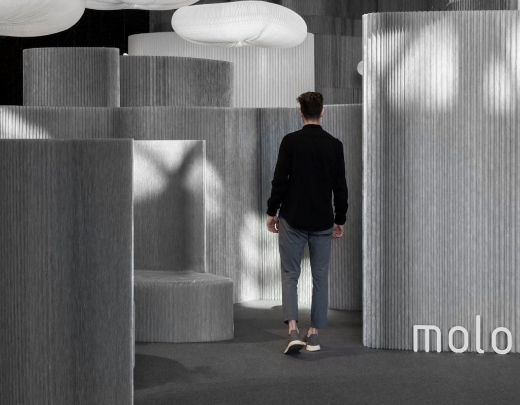 Aluminum textile space division and benches with man walking