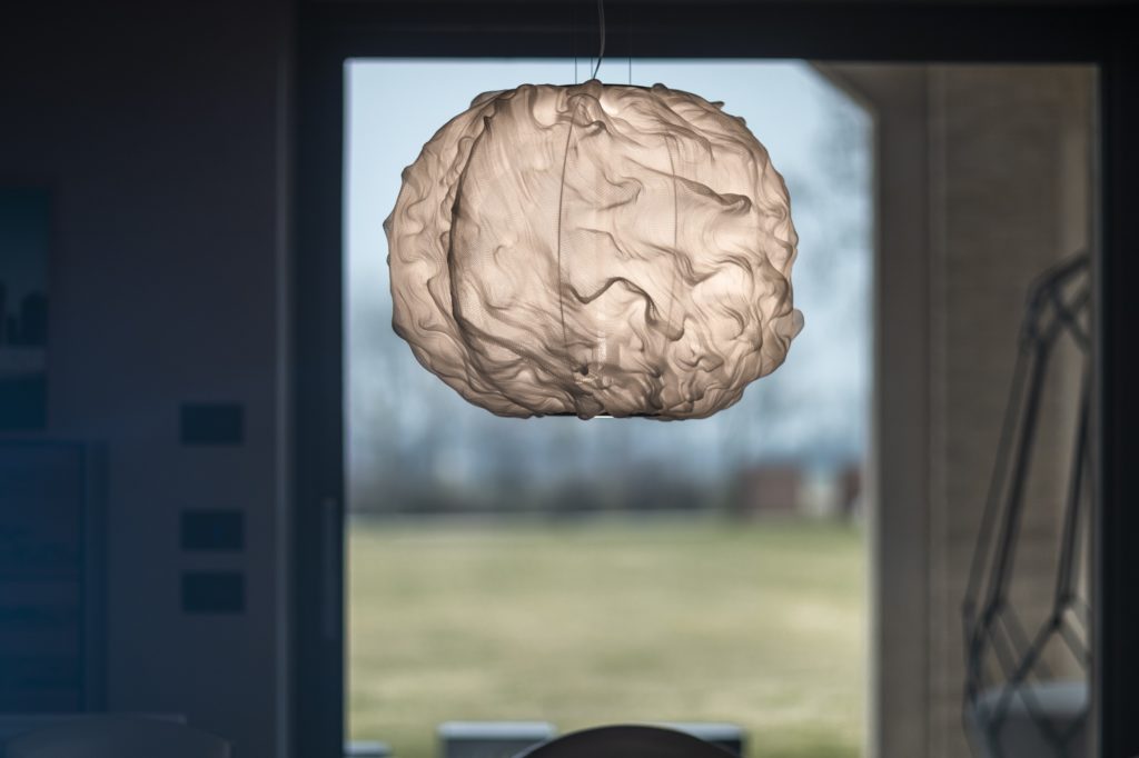Suspension lamp in doorway, illuminated