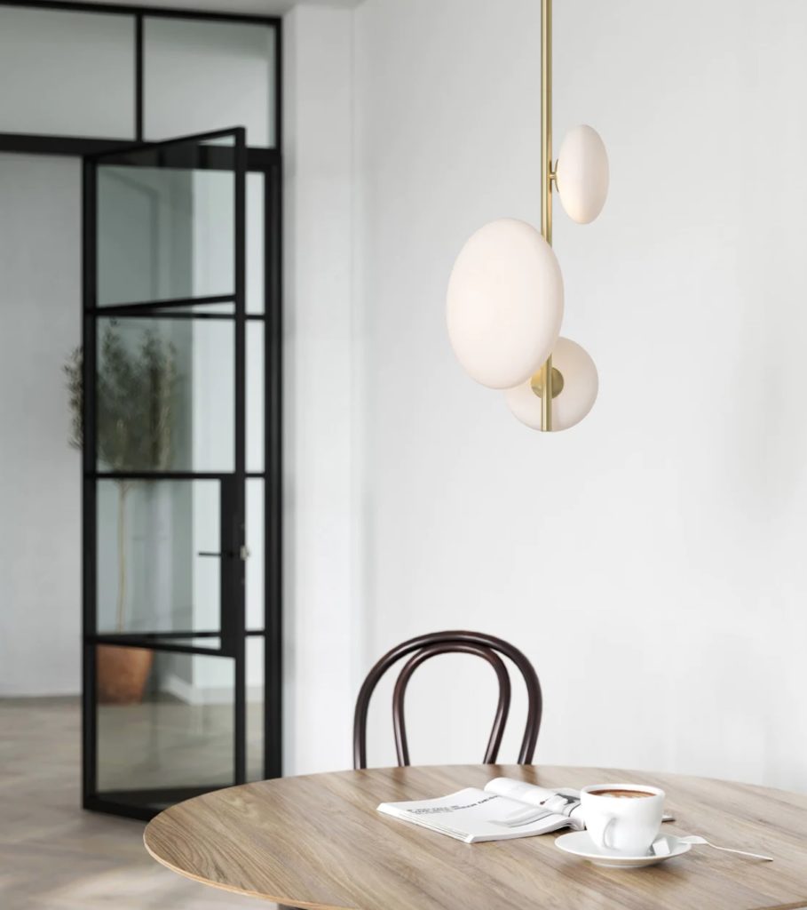 Imperial 3 light brass and opal pendant above kitchen table