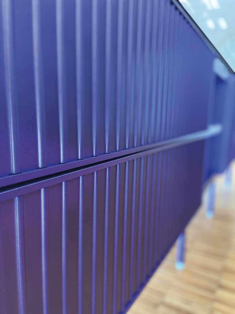aluminum detail of outdoor kitchen in purple