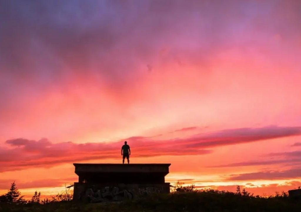 Summer sunrise with man in silhouette