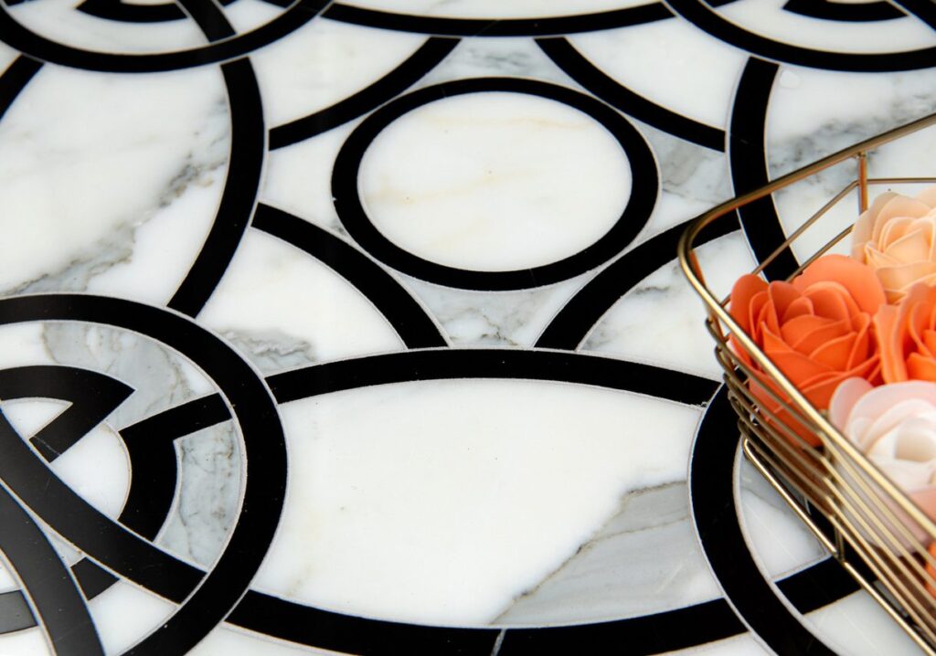 Norris pattern of mosaics with black geometric shapes on white background with marble appearance