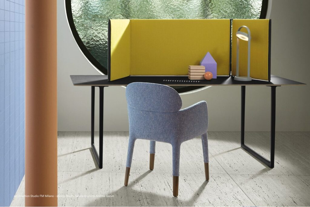 Giravolta table lamp in gray on desk with privacy panel