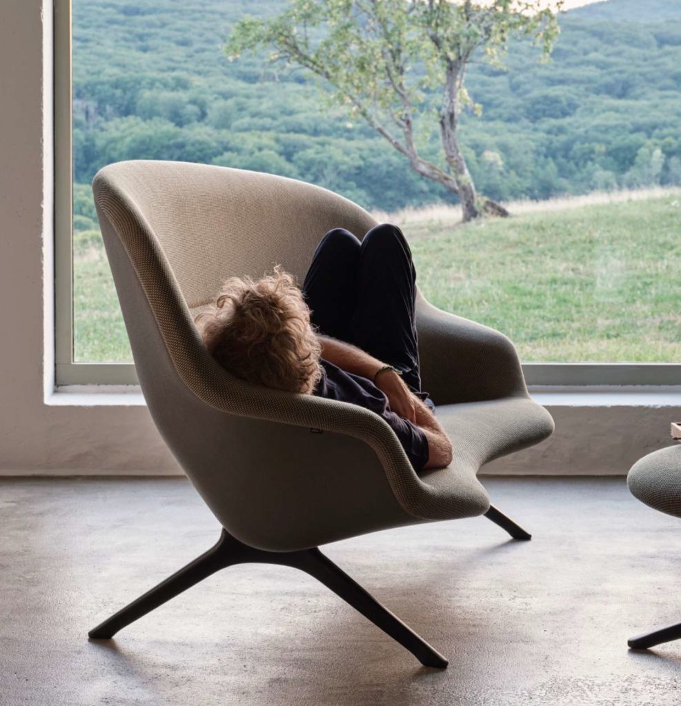 Abalon sofa with reclining man and nice view out window