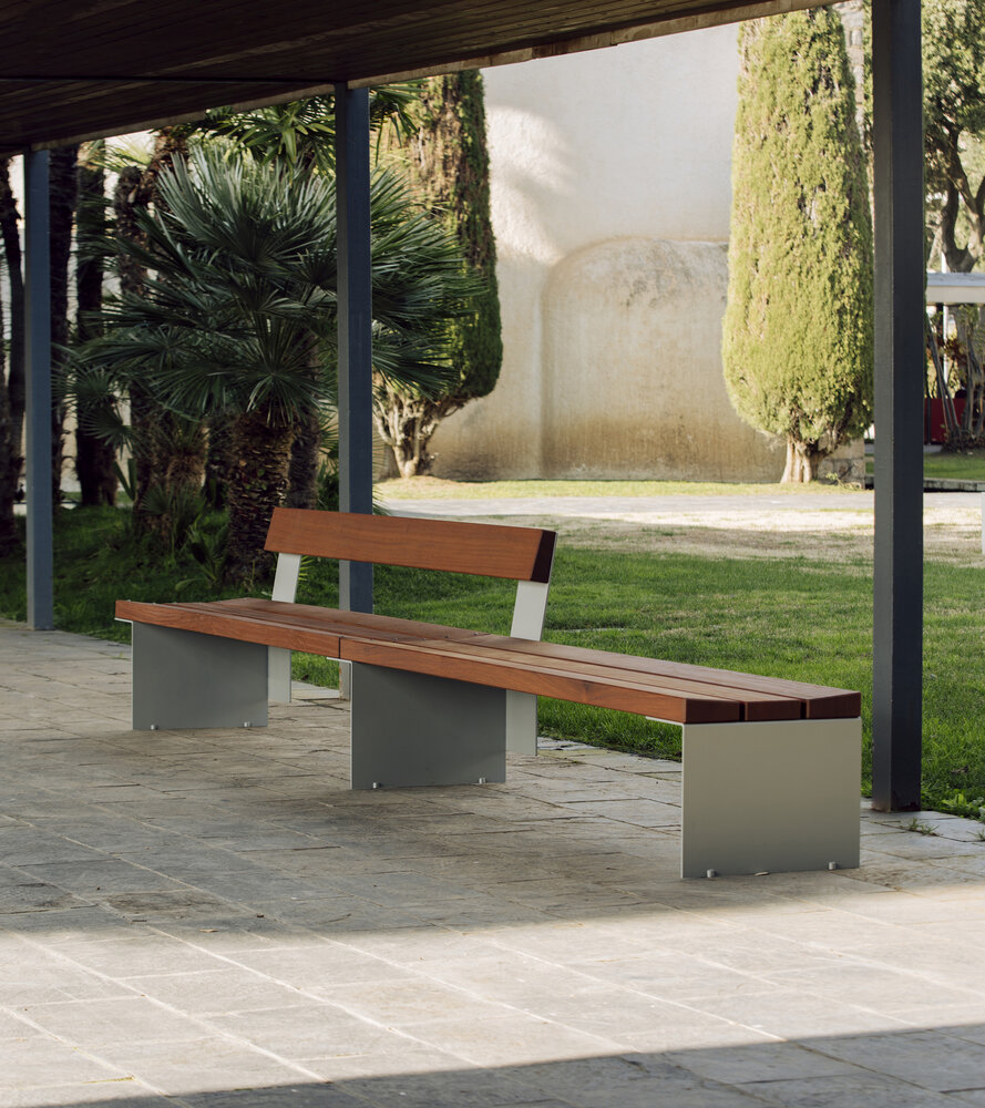 Long bench in building portico