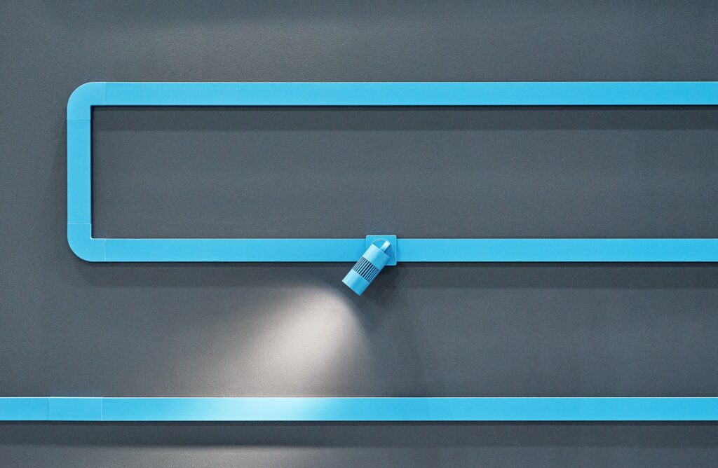 Mlutiverse in rich blue on gray wall