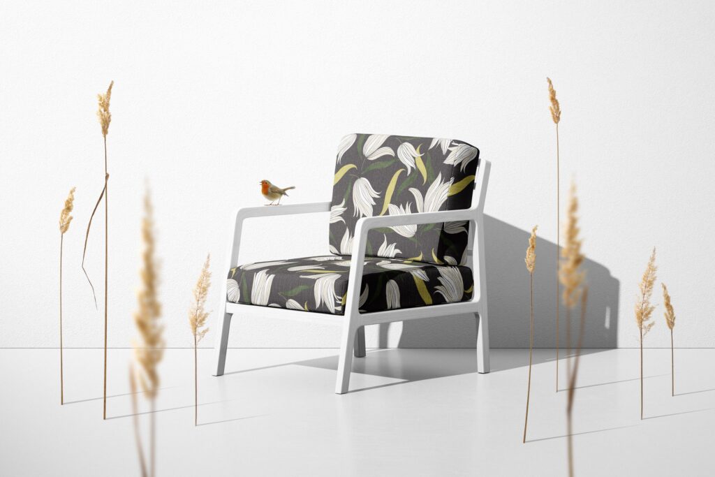 Textiles by Abnormals Anonymous on chair upholstery in Secret Garden print with bird