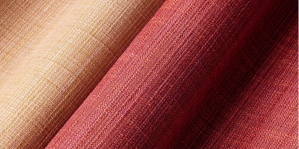Particulate detail with subtle texture and peach/pink/red tones