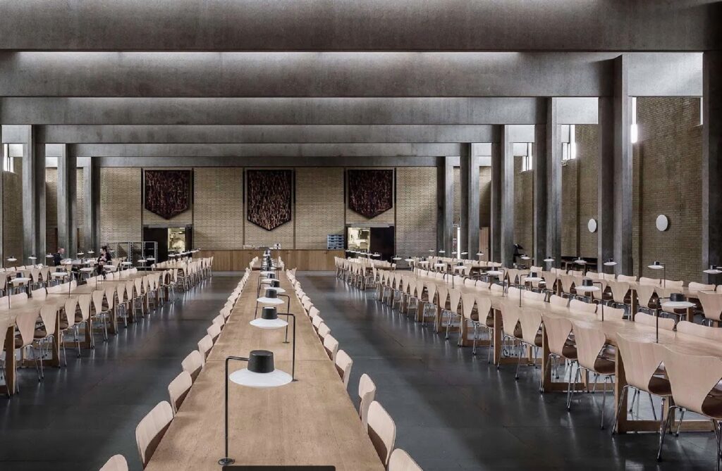 AJ Oxford row of lamps on long table at St. Catherine's dining hall