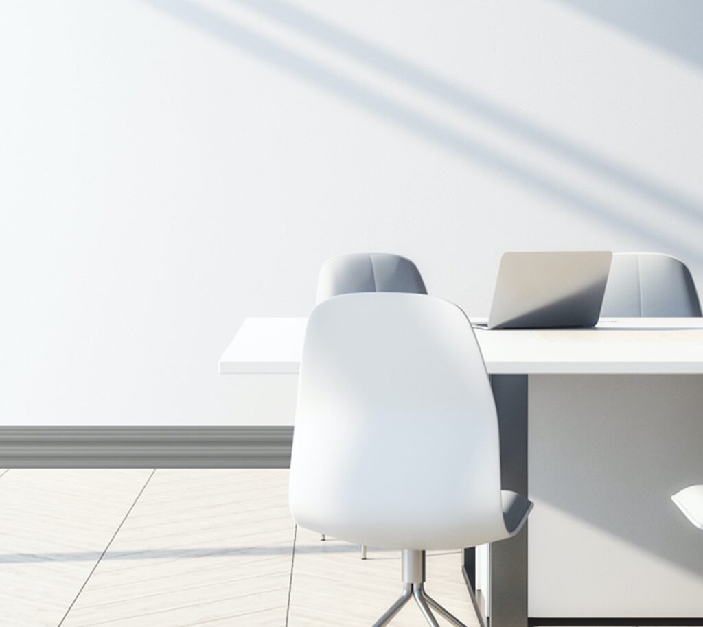 Wall base in gray with complex profile in office 