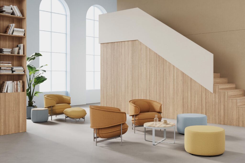 Lounge chairs with ottomans in orange,, yellow, and light blue