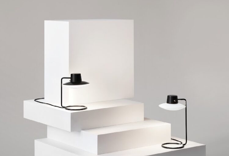 AJ Oxford on white pedestal two lamps one with top shade and one without