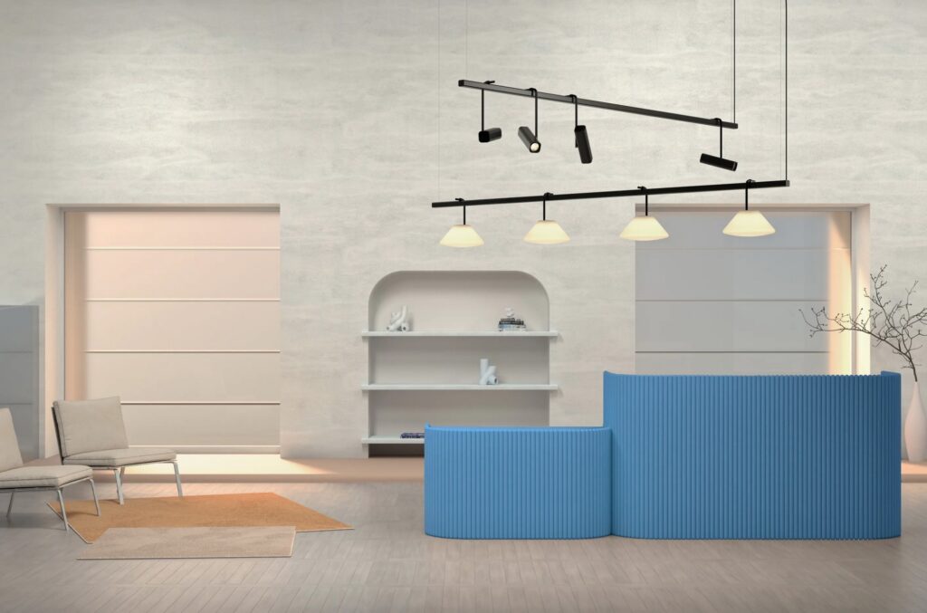 Two fixtures with four spotlights on one and conical shade on the other in reception area