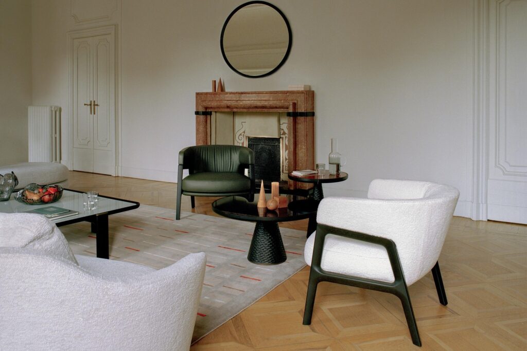 Duo armchairs green and white with partial view of rectangular table