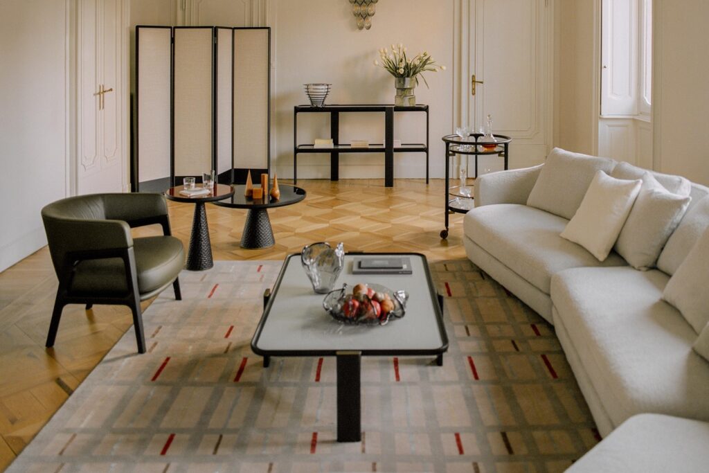 Rectangular table with DUO armchair and large white sofa