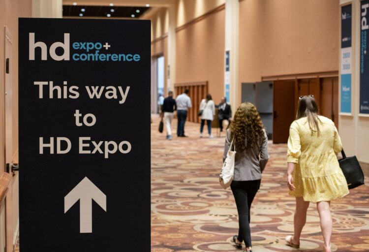Hotel conference area with sign pointing the way to HD Expo