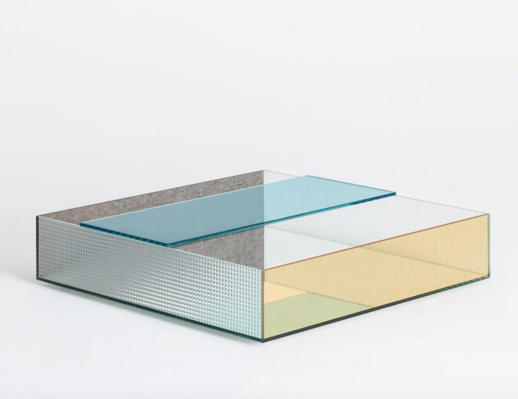 Spectrum table with yellow and sky blue glass and gray fabric