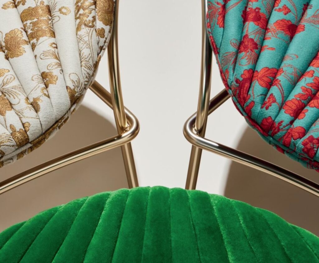 three chairs detail of upholstery: white/gold, aqua/red, green